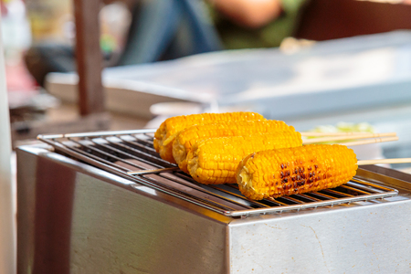 grilled corn vegetable on stove.の写真素材