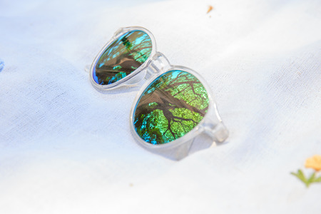 fashion eye glass on white fabricの写真素材