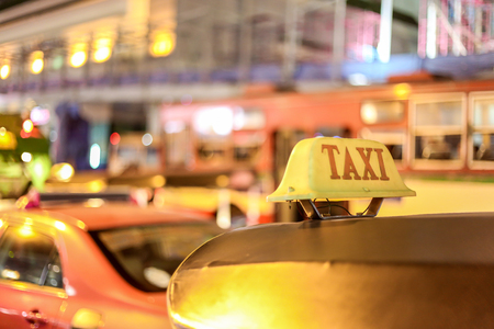 Closeup to taxi sign on the street of Bangkok, Thailand.の写真素材