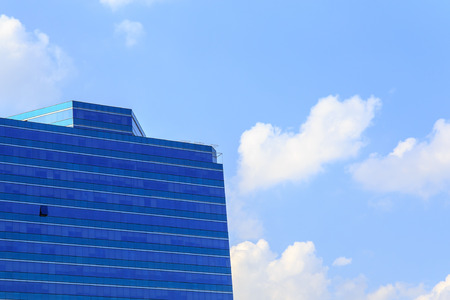 Office building on sky background.