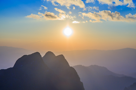 Sunset with clouds over top of mountain at Doi Luang Chiang Dao, Chaingmai, Thailandの写真素材