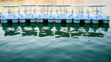 Duck boat in lake with sunset or evening light tone of Bangkok, Thailand.の写真素材