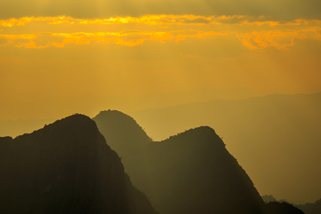 Sunset with clouds over top of mountain at Doi Luang Chiang Dao, Chaingmai, Thailandの写真素材