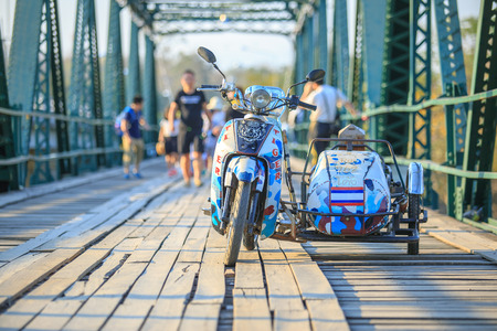 Maehongson, Thailand. - February 21, 2017 : Motorcycle or scooter bike on Memorial bridge at Mae Hong Son province, Thailand.のeditorial素材