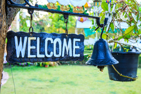 Welcome sign with iron bell.の写真素材