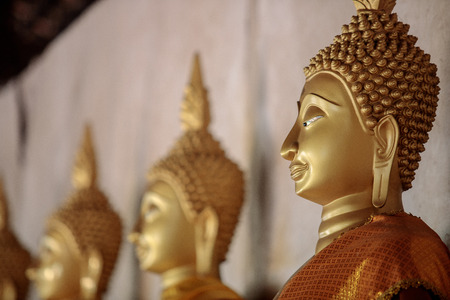 Closeup to head of stone buddha statue in temple Ayuthaya, Thailand.の写真素材