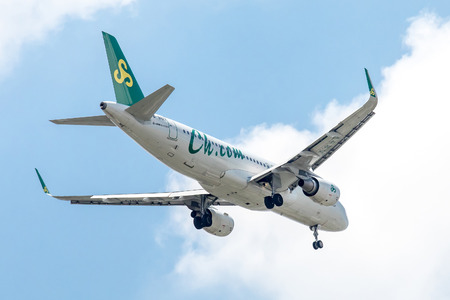 Bangkok, Thailand. - April 8, 2017 : Plane of Spring Airlines or Airways on the sky landing to Suvanabhumi airport.のeditorial素材