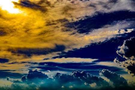Dramatic blue sky and clouds at sunset or evening time.