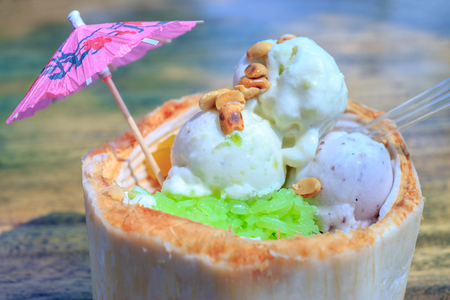 Ice Cream with nuts in coconut shell.の写真素材