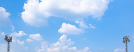 Two or double of Lighting tower of stadium on sky and cloud background.の写真素材