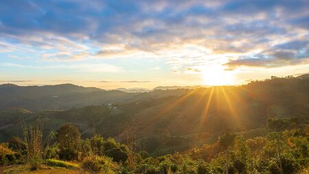 Sunset over clouds with mountain hill forest.の写真素材