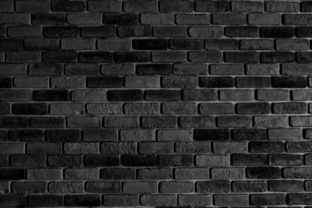 Old brick wall in dark or black with bw or black and white tone for backdrop or background.の写真素材