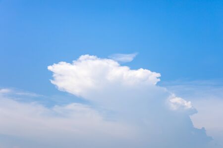 Blue sky and soft white clouds at day time for background.