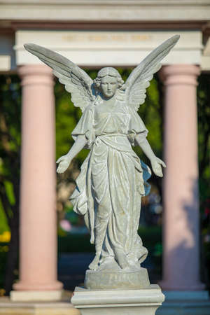 Angel statue in the public park english garden style.の写真素材