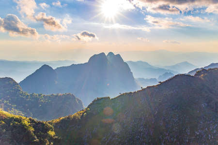 Mountain with Sunset or evening time with blue sky and sunray or sunbeam with clouds at Doi Luang Chiang Dao, Chaingmai, Thailand. Asia.の写真素材