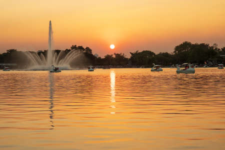Bangkok, Thailand. - December 10, 2019 : People ride duck boat at public park name Suan Luang Rama IX on sunset time Bangkok, Thailand.のeditorial素材