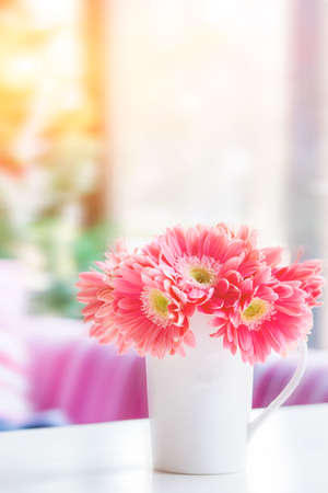 Coffee shop table flower decorationsの写真素材