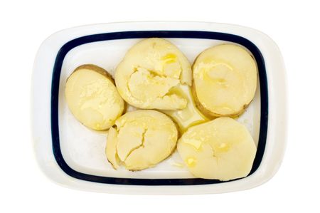 a tray of healthy boiled potatoes with olive oilの写真素材