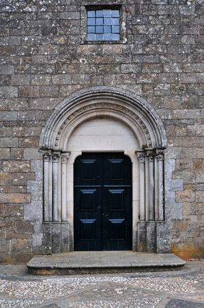 a church closed door with a window in the topの写真素材