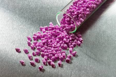 pink polymer resin in test-tube on stainless steel sheet