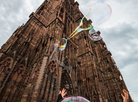 imploding colorful soap bubble near dom