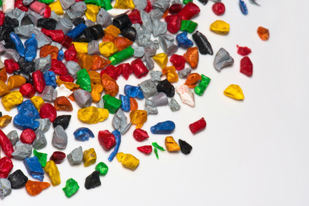 recycled colored plastic parts isolated on whiteの写真素材