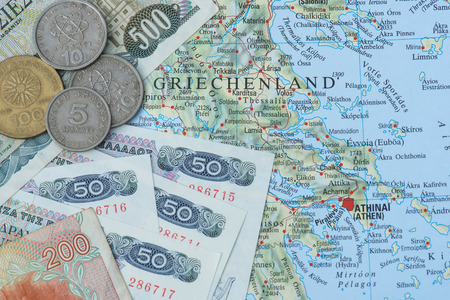 old greek currency drachma on map og Greece