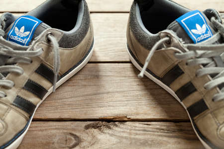 Used classic adidas on old wood floor. This file is cleaned and retouched.のeditorial素材