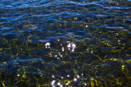 Sunbeam glowing in lakeの写真素材