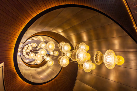 Modern spiral staircase artistic lighting.