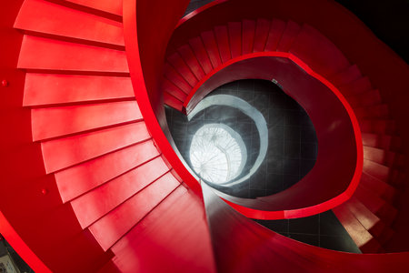 Red cool spiral staircase top view.の写真素材