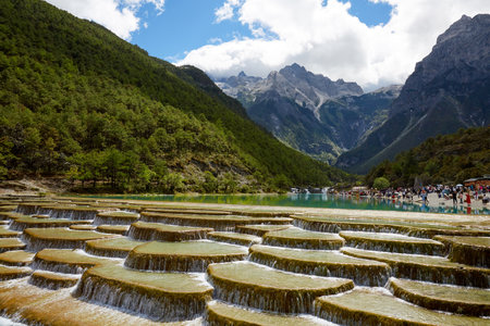 Lijiang Blue Moon Valley travertine pool landscape amidst mountains and waters, Yunnan, Chinaの写真素材