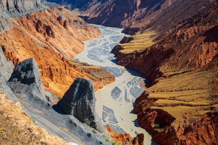 Anjihai Grand Canyon Danxia landform and river, Xinjiang, Chinaの写真素材