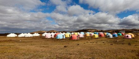 Multicolored dome camping cabins on Ulan Butong Grassland, Chinaの写真素材