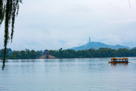 West Dyke ancient architecture and Western Hills misty rain scenery at Kunming Lake in Beijing Summer Palace, Chinaの写真素材