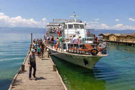 PESTANI, MACEDONIA - MAY 29, 2018: People getting of the boat at the Bay of Bones in Pestaniのeditorial素材