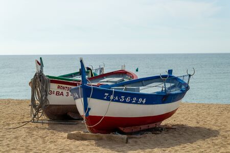 CALELLA, SPAIN - MAY 19, 2011: Fishing rowboats in the sunのeditorial素材