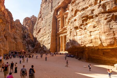 Petra, Jordan - Sept 21, 2013: Tourists looking at the Treasury building in Petra, Jordan. Very...