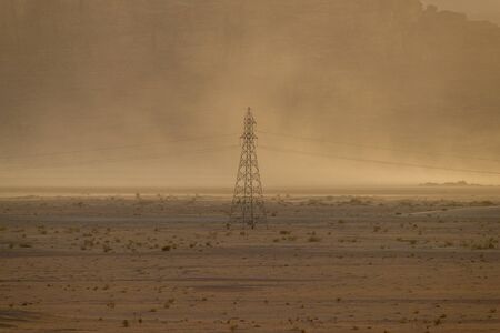 Power line tower in the middle of the Wadi Rum desertの写真素材