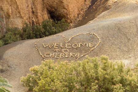 Welcome to Chebika with a heart around it made in stonesの写真素材
