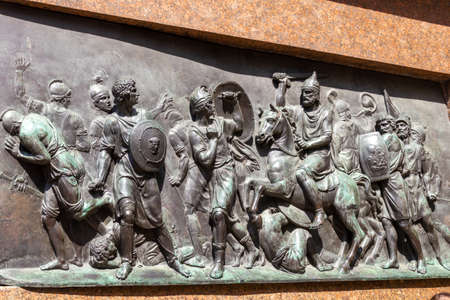 Relief on feet of statue outside Saint Basil Cathedral