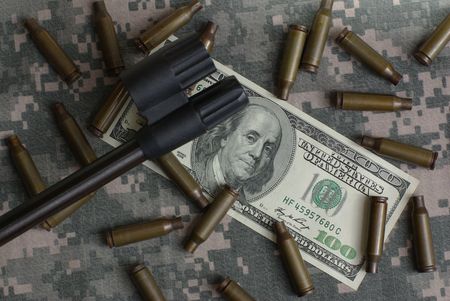 rifle, money and shellsの写真素材