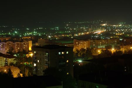 Cityscape with blocks of flats at nightの写真素材