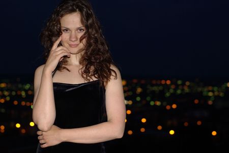 Girl and city in a nightの写真素材