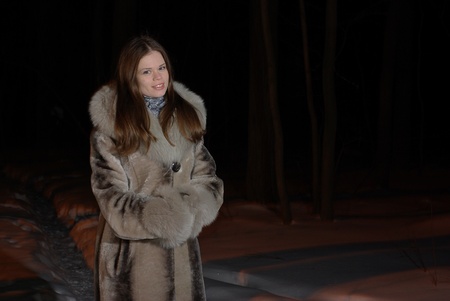 female walking in a winter forestの写真素材