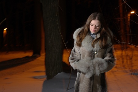 Female in winter forestの写真素材