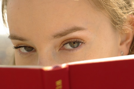 Girl with a red bookの写真素材