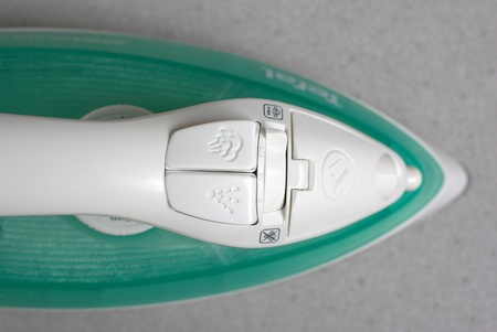 Green steam ironの写真素材