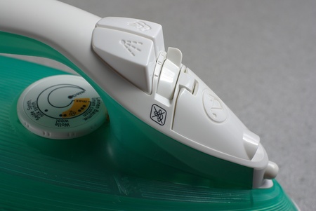 Steam iron on the greyの写真素材