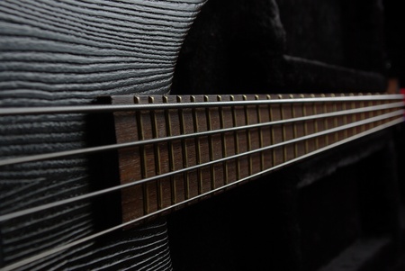 Bass guitar neck on the black